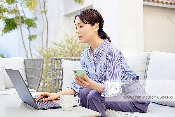 Japanese woman working on laptop