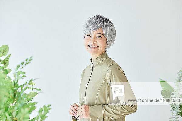 Senior Japanese woman gardening
