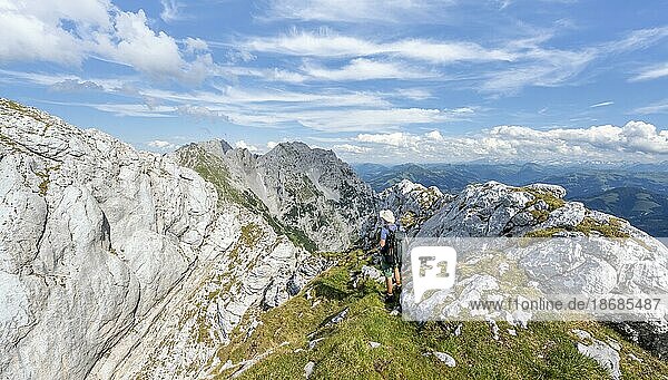 Mountaineer on a narrow ridge path  crossing the Hackenköpfe  rocky mountains of the Kaisergebirge  Wilder Kaiser  Kitzbühler Alps  Tyrol  Austria  Europe