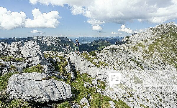 Climber on a rocky ridge  traversing the Hackenköpfe  ridge path  Kaisergebirge  Wilder Kaiser  Kitzbühler Alps  Tyrol  Austria  Europe
