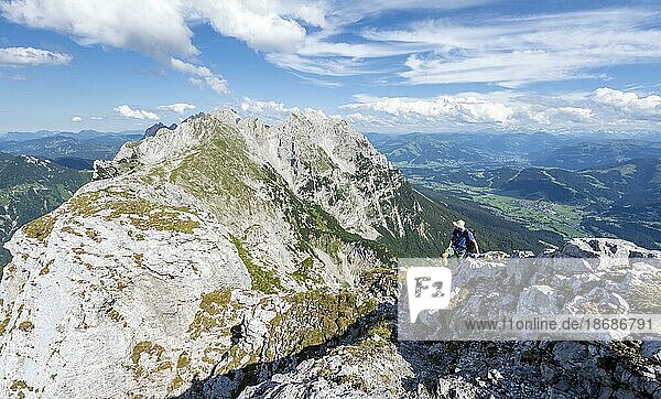 Mountaineer on a narrow ridge path  crossing the Hackenköpfe  rocky mountains of the Kaisergebirge  Wilder Kaiser  Kitzbühler Alps  Tyrol  Austria  Europe