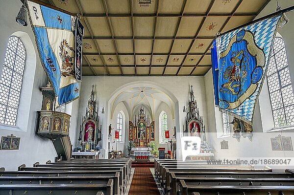 The church of St. Michael with coffered ceiling and flags  one of the oldest churches in the Allgäu  listed as a historical monument  Krugzell  Allgäu  Bavaria  Germany  Europe