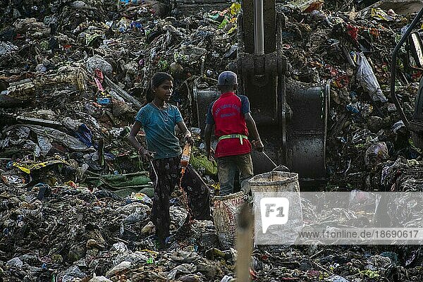 GUWAHATI  INDIA  JUNE 4: Child ragpickers collect reusable items at the Boragaon garbage dumping site  ahead of World Environment Day  on June 4  2023 in Guwahati  India. World Environment Day is the biggest international day for the environment  celebrated annually on 5 June