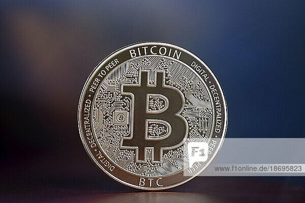 Close-up of gold colored Bitcoin coin