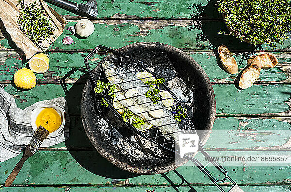 Fish cooking on barbecue grill