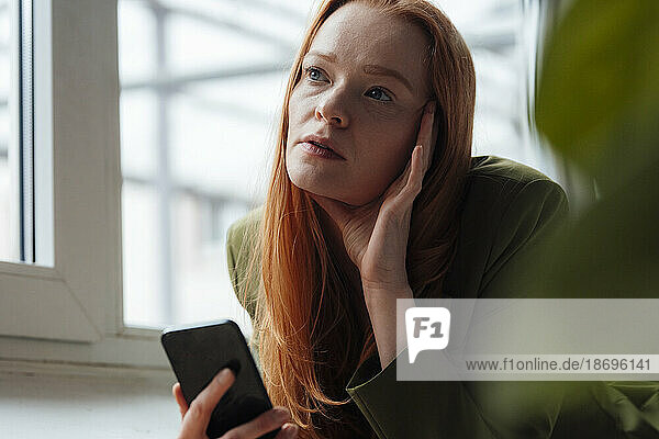 Worried woman with smart phone