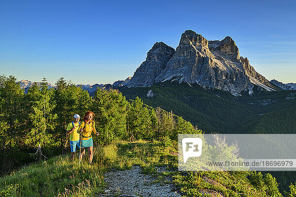 Italy  Province of Belluno  Hikers at Val di Zoldo in Dolomites