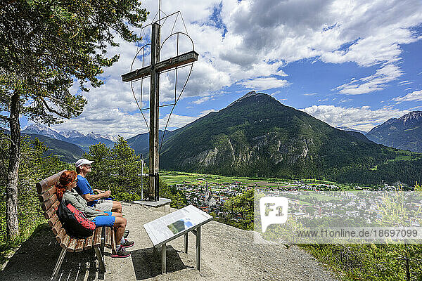 Austria  Tyrol  Imst  Hiking couple taking break at Wetterkreuz observation point