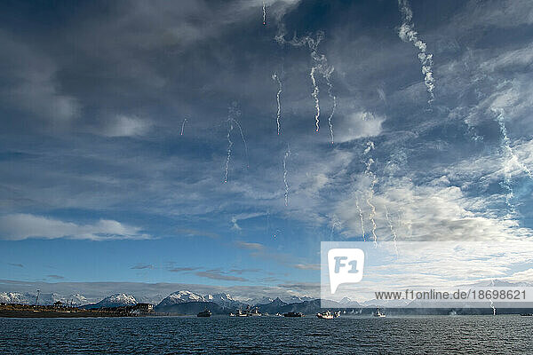 Smoke trails in the sky from flares off the coast of Alaska; Alaska  United States of America