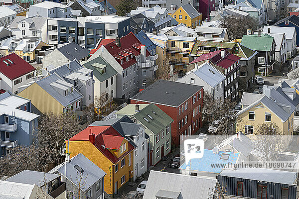Close-up aerial view of downtown Reykjavík as seen from the top of the church  with brightly colored houses and rooftops creating a beautiful effect; Reykjavík Iceland