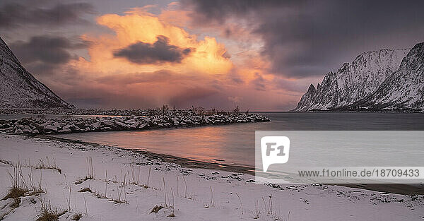 Panoramic image of Ersfjorden and The Devils Teeth viewed from Ersfjordstranda beach at sunset in winter  Senja  Troms og Finnmark County  Norway  Scandinavia  Europe