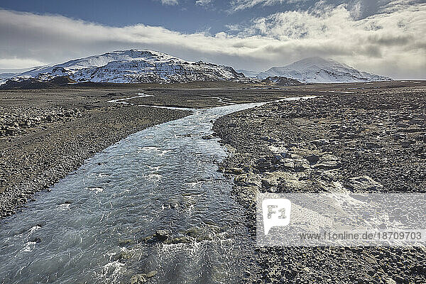 Snow-clad mountains and the Geita River in early winter  at the foot of the Langjokull ice-cap  in the western Highlands  west Iceland  Polar Regions