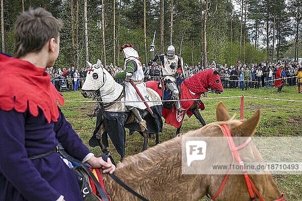Men Swordfight From Horseback During A Festival Of Medieval Culture In Russia