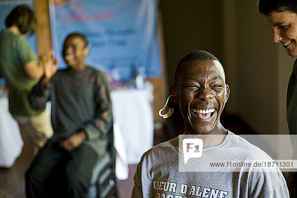 A happy young man hears for the first time with a little help from a sponsor.