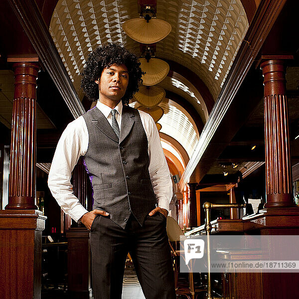 Portrait of a man in a tie and vest from lifestyle shoot at the Ginger Hop in Minneapolis  Minnesota.