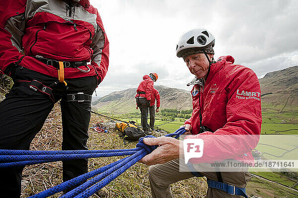 Members of the Langdale/Ambleside mountain Rescue setting up belays on a Team training in the Langdale Valley  Lake District  UK.