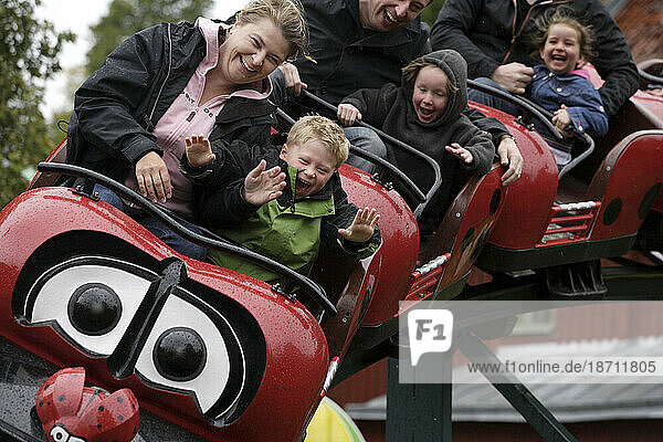 An autistic child rides a roller coster with his mother in Stockholm  Sweden as a way to encourage joy to expand his learning capabilities.