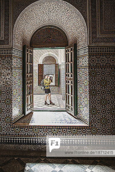A female tourist takes a picture inside the casbah in Telouet  Morocco