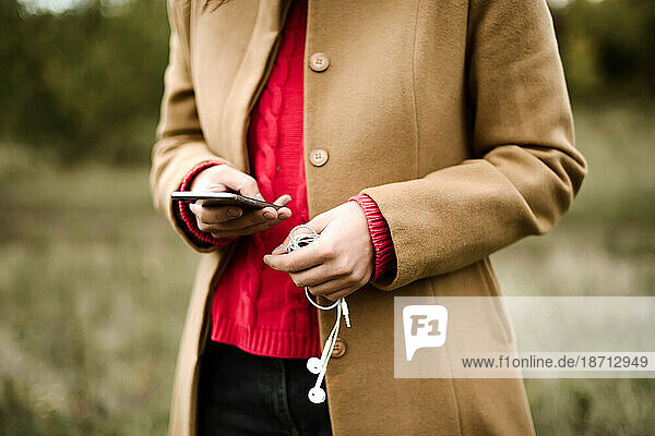 Woman Holding Her Phone outdoor