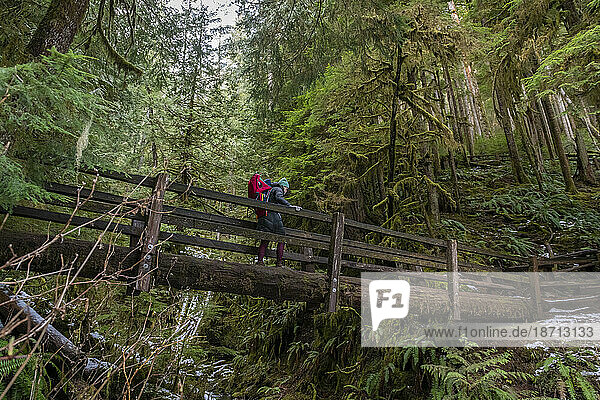 Woman hiking with child in Olympic National Park  Washington