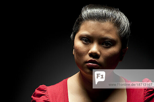 Studio portrait of a 21 years old Asian woman.