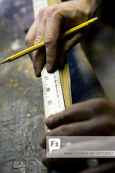 A craftsman works on a hand-made bow in his workshop in Lake Pleasant  Massachusetts.