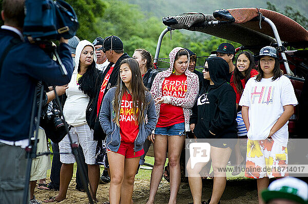 Some of the Aikau Ohana are interviewed by reporters as they watch the surf a day before the 25th Eddie Aikau Big Wave Invitational. The biggest swell on the North Shore for 10 yea