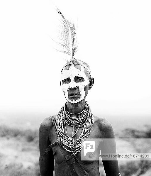 A portrait of a woman dressed in the traditional clothes and decoration in the Omo Valley  Ethiopia. (black and white)