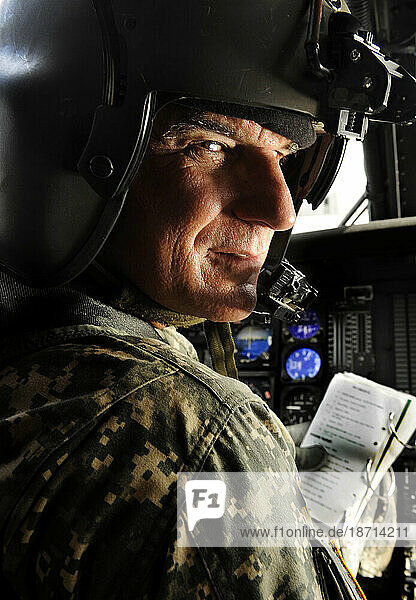 A soldier goes through his preflight checklist before taking off on a routine helicopter flight.
