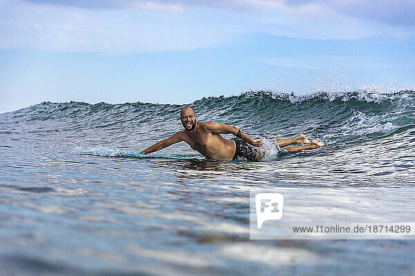 Surfer in sea â€ Changgu  Bali  Indonesia