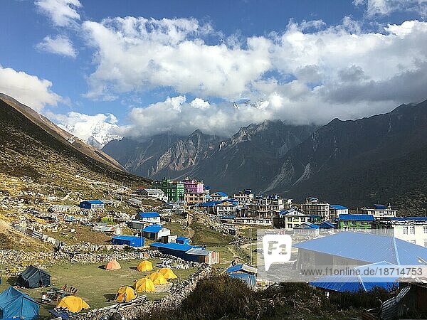 Overlook view of mountain town in the Himalayas with clouds