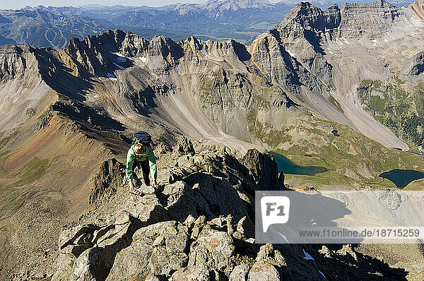 A woman climbs the Southwest ridge of Mount Sneffels (14 150 feet) in Southwestern Colorado.
