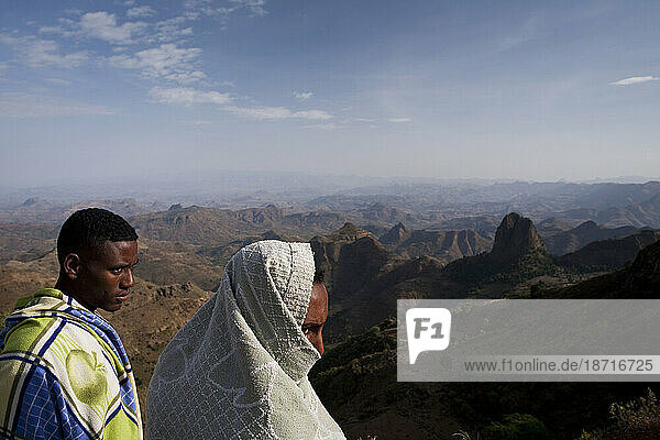 Ethiopian men survey the rugged landscape of Simien Mountains National Park  Northern Ethiopia.