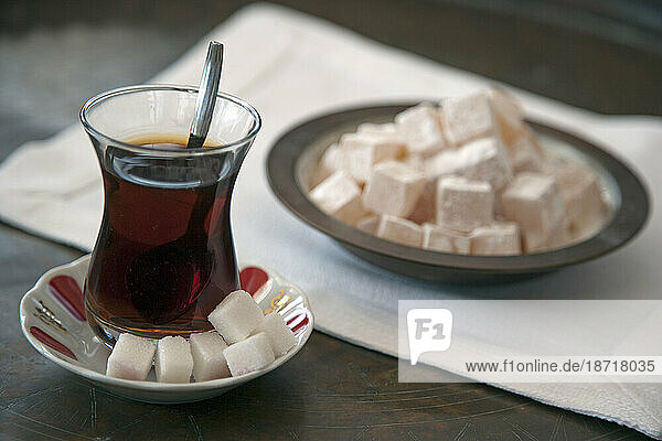 A glass of Turkish Tea and Bowl of Turkish Delight or Loukoum. Istanbu