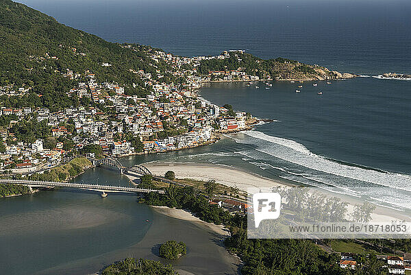 Aerial view to river mouth and ocean beach in beautiful residential