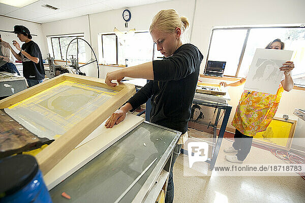 An art student makes silk screen prints at Sierra Nevada College  Lake Tahoe  Nev.