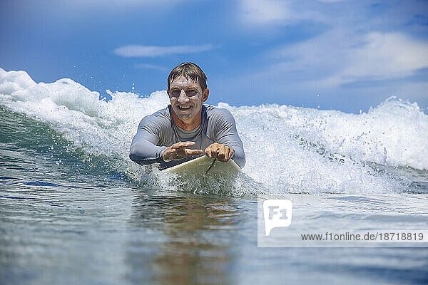Surfer in sea â€ Jimbaran  Bali  Indonesia