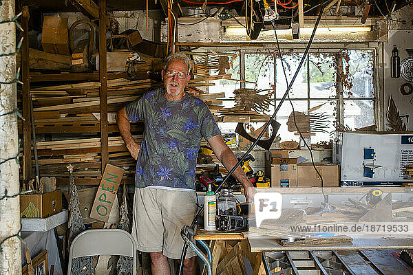 Portrait of a proud business owner and craftsman in his workshop