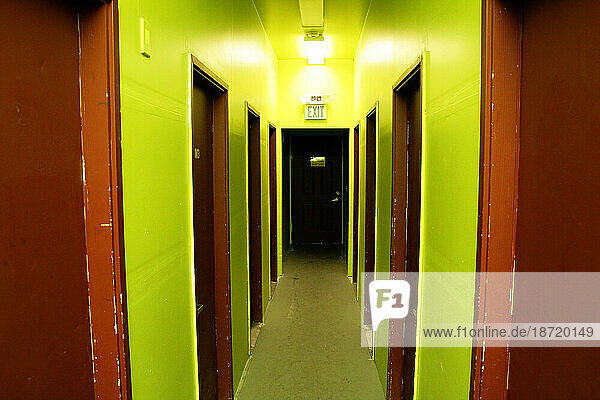 View down a brightly painted hallway of rental creative spaces and rehearsal studios in Seattle  Washington.