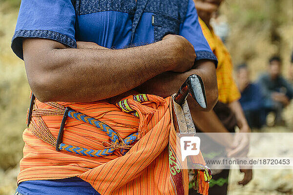 Close up of hand and machete  Pasola festival  Sumba Island  Indonesia