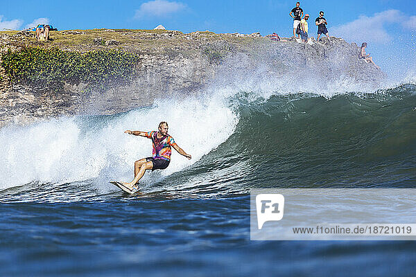 Surfer riding wave in sea â€ Jimbaran  Bali  Indonesia