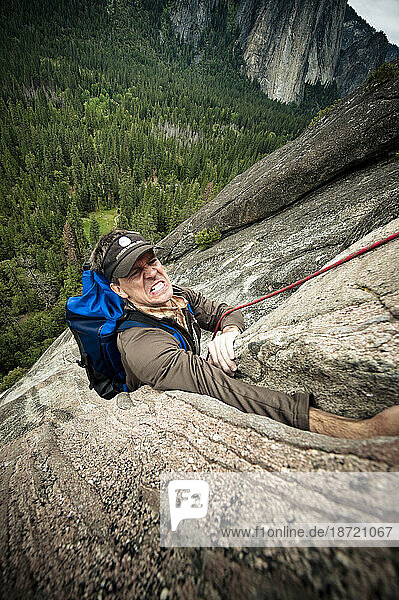 A climber reaches his hand in a crack in Yosemite  June 2010.