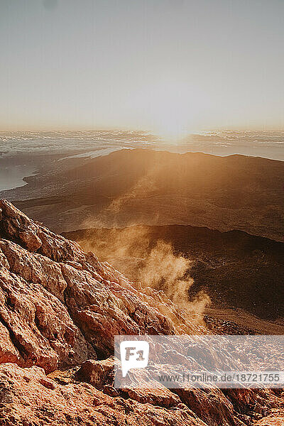 Backlight fumarole at mount Teide slope at sunrise
