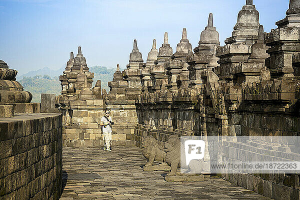 Tourist Exploring Borobudur Temple In Yogyakarta  Java Island  Indonesia