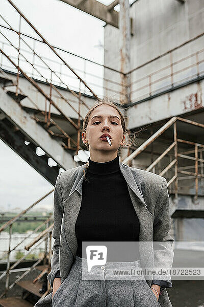 Girl with a cigarette in a business suit