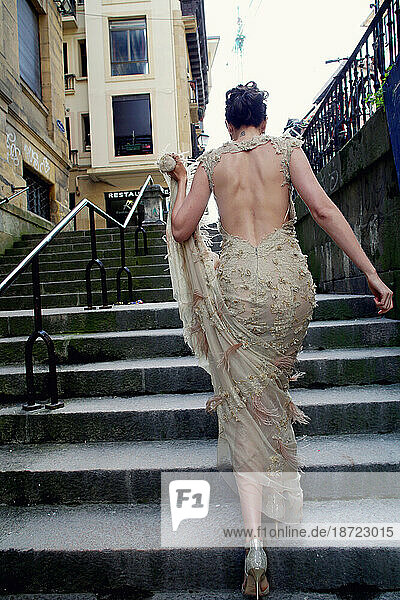 run away bride on steps in downtown San Sebastian  Spain