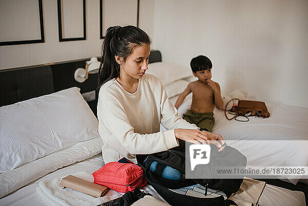 Asian woman and boy in a room
