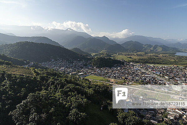 Aerial view from helicopter flight to poor favela area and mountains