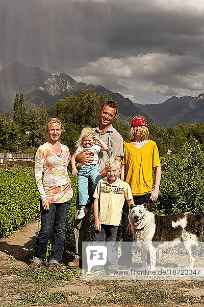 The Family owners of a local organic garden and their children at their farming operation in Sandy Utah.