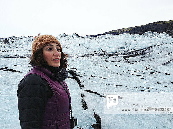 Woman looking out over Solheimajokull Glacier Iceland